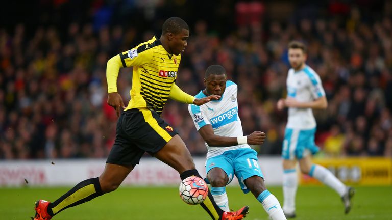 Chancel Mbemba of Newcastle United and Obbi Oulare of Watford compete for the ball 