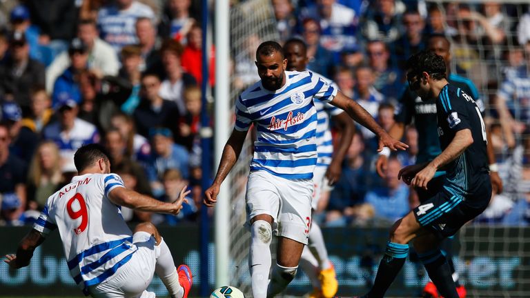 Charlie Austin and Sandro of QPR and Cesc Fabregas of Chelsea compete for the ball 