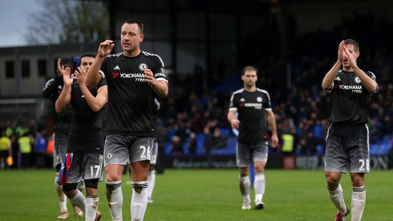 John Terry of Chelsea and his team-mates applaud the fans