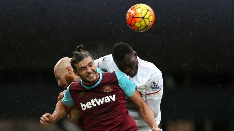 Liverpool's Christian Benteke (R) vies with West Ham United's James Collins and Andy Carroll (C) at the Boleyn Ground in January 2016