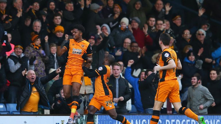 Chuba Akpom (L) of Hull City celebrates scoring his team's first goal with his team mate Sone Aluko (C) during the FA Cup fourth round match against Bury