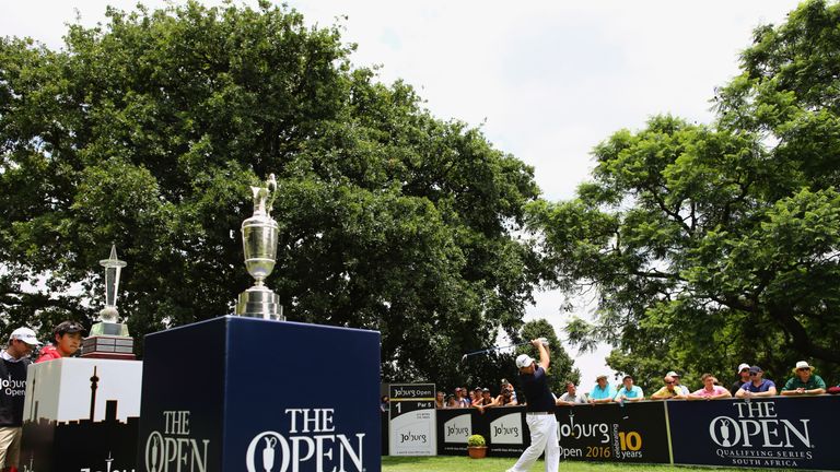 Wall tees off at the first with the Claret Jug in attendance