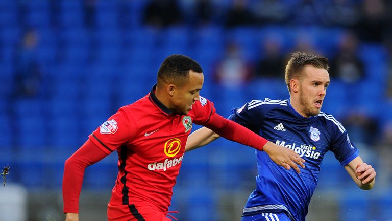 Craig Noone of Cardiff City and Blackburn's Marcus Olsson battle for posession