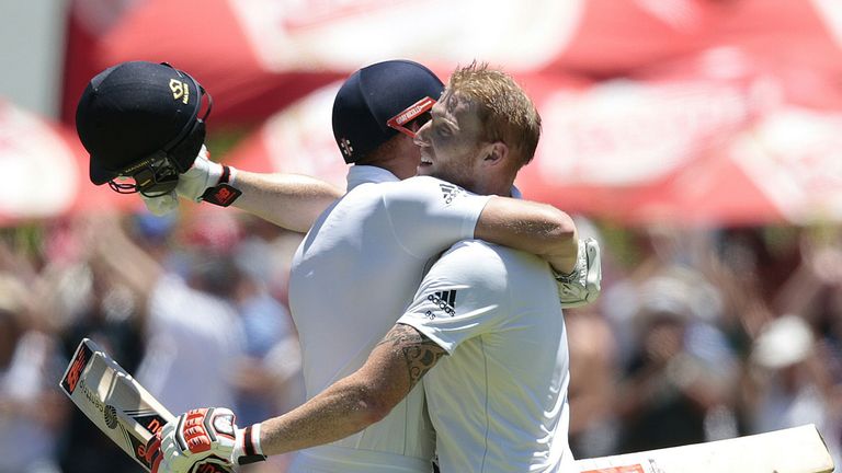 England's batsman Benjamin Stokes (R) embraces fellow batsman Jonathan Bairstow