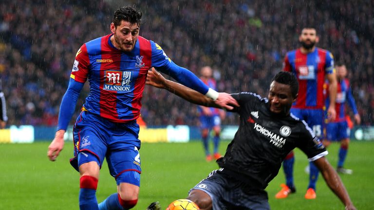 Joel Ward battles for the ball with John Obi Mikel