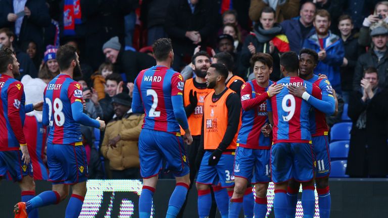  Wilfried Zaha (far right) of Crystal Palace celebrates scoring his team's goal against Stoke
