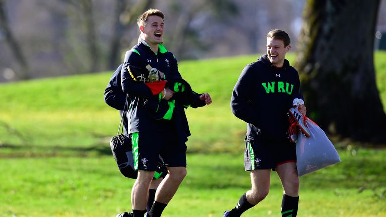 Wales players Jonathan Davies (left) enjoys a joke with Dan Biggar as they make their way to Wales open training session
