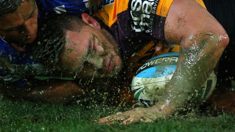 Sam Perrett of the Bulldogs tackles Daniel Vidot of the Broncos during the round 18 NRL match between the Canterbury Bulldogs