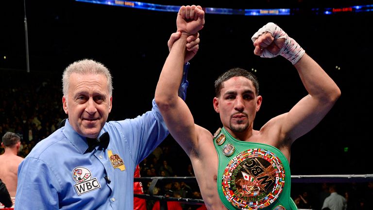 Referee Jack Reiss holds up the hand of Danny Garcia after he defeated Robert Guerrero on unanimous decision to win the WBC welterweight title
