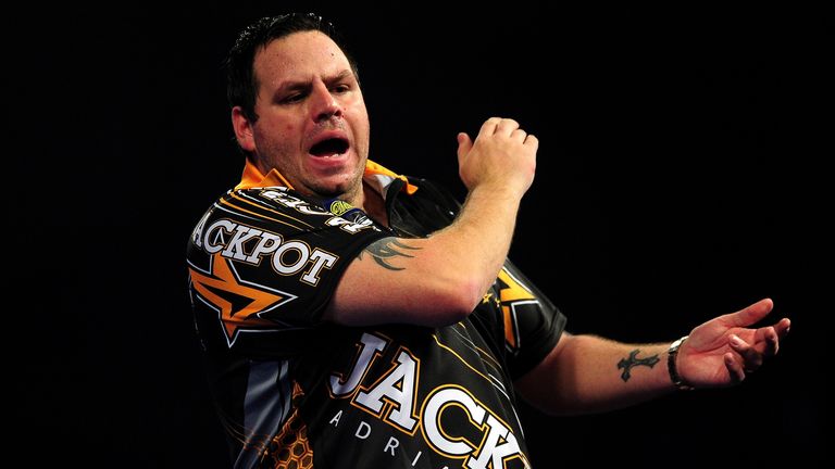 Adrian Lewis of England celebrates winning the second set against Gary Anderson