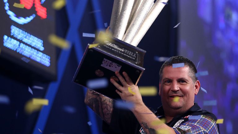 Gary Anderson lifts the trophy after winning the final of the William Hill PDC World Championship at Alexandra Palace, London