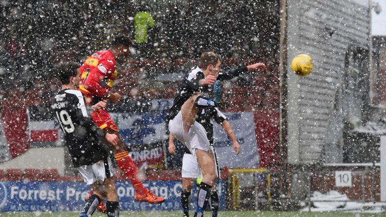 David Amoo heads the ball home to pull a goal back for Partick against Dundee