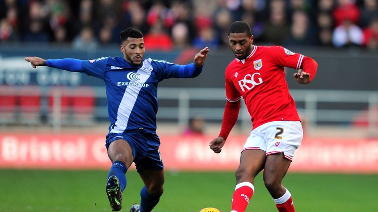 BRISTOL, ENGLAND - JANUARY 30: Mark Little of Bristol City is tackled by David Davis of Birmingham City during 