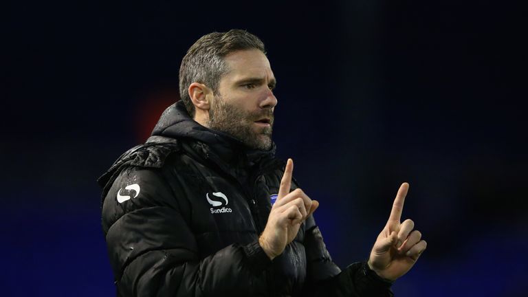 David Dunn the manager of Oldham Athletic looks on
