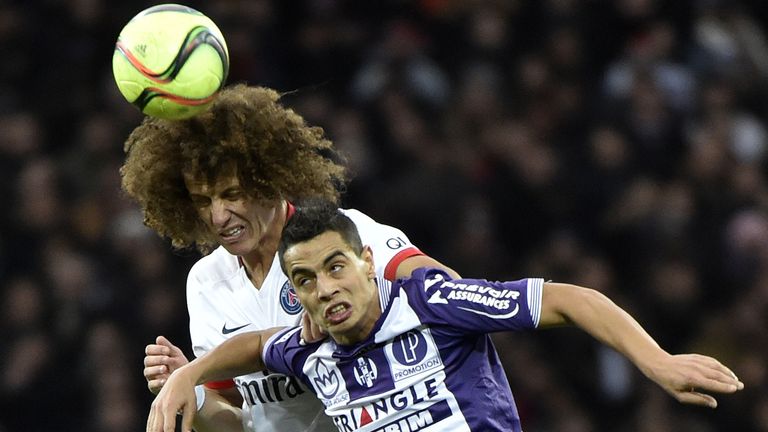 Paris Saint-Germain's Brazilian defender David Luiz (R) vies 