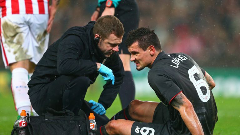 Dejan Lovren is treated before his substitution at the Britannia Stadium