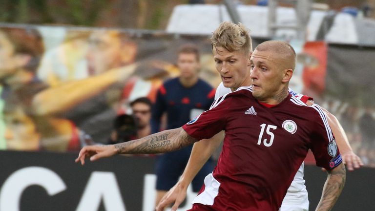 Deniss Rakels (foreground) in action for Latvia