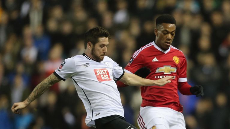 United's Anthony Martial battles with Jacob Butterfield for the ball