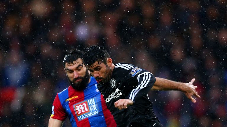 Diego Costa battles for the ball with Damien Delaney 