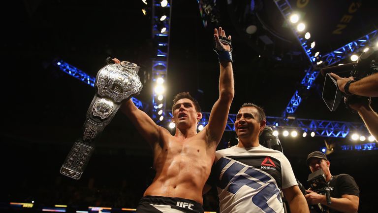 Dominick Cruz celebrates defeating T.J. Dillashaw (not pictured) to win the World Bantamweight Championship during UFC Fight Nigh