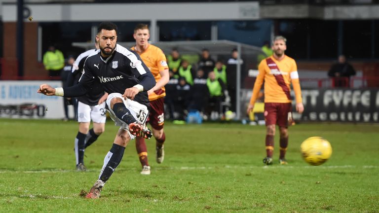 Dundee's Kane Hemming's scores a penalty for his side to equalise for the second time 