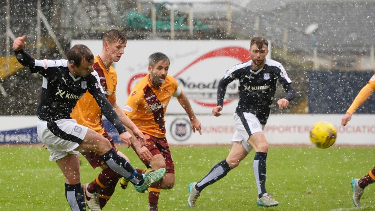 Dundee's Paul McGowan (front) fires in an equaliser for his side  