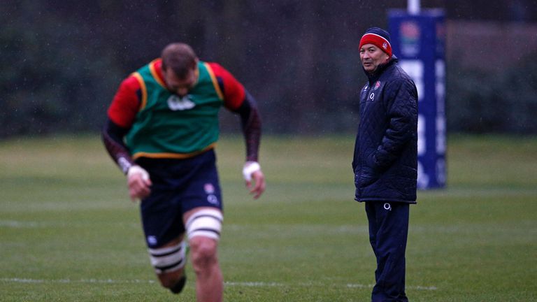 England head coach Eddie Jones watches as former captain Chris Robshaw takes part in a training session