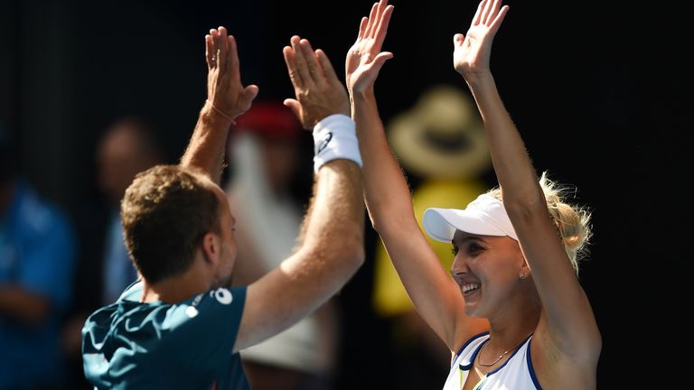 Elena Vesnina of Russia (R) and partner Bruno Soares of Brazil (L) celebrate their victory in the Australian Open mixed doubles
