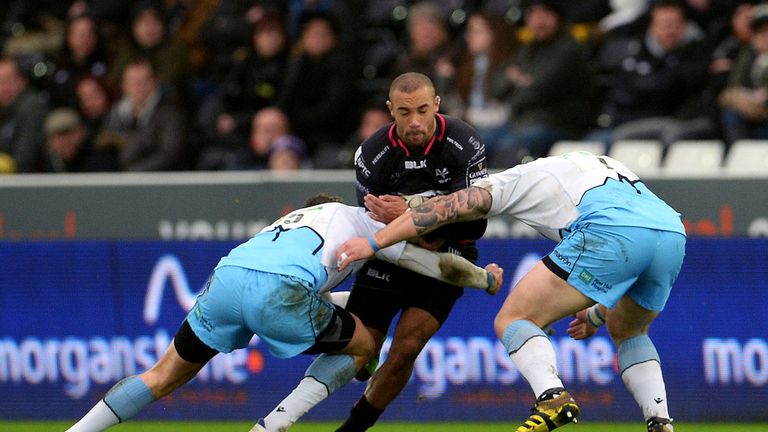 Ospreys' Eli Walker tackled by Glasgow Warriors' Peter Murchie and Ryan Grant