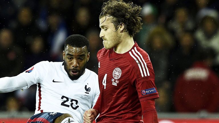Erik Sviatchenko in action for Denmark as he blocks a shot from France forward Alexandre Lacazette