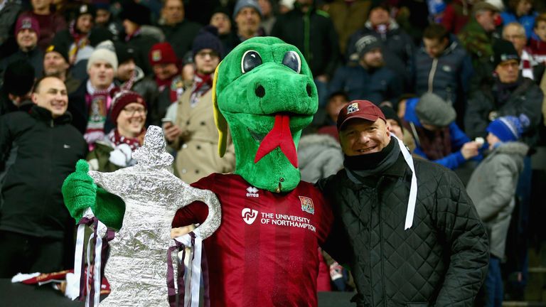MILTON KEYNES, ENGLAND - JANUARY 19:  A Northampton Town fan is seen with a tin foil replica of the FA Cup during The Emirates FA Cup third round replay ma