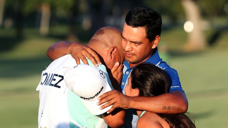 Fabian Gomez of Argentina celebrates with his caddie after winning during a playoff in the final round of the Sony Open In Hawaii