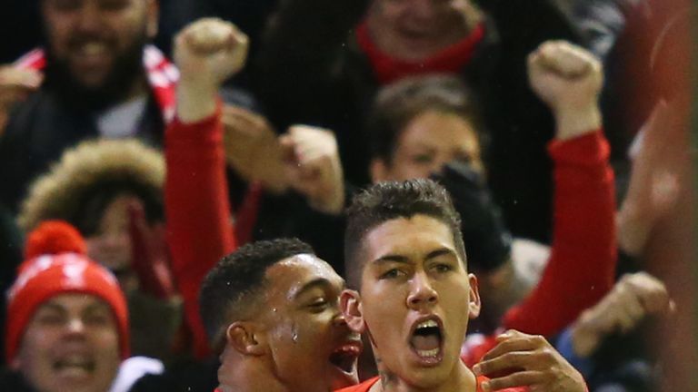 Roberto Firmino (right) of Liverpool celebrates scoring his team's first goal against Arsenal with his team-mate Jordon Ibe (left) 
