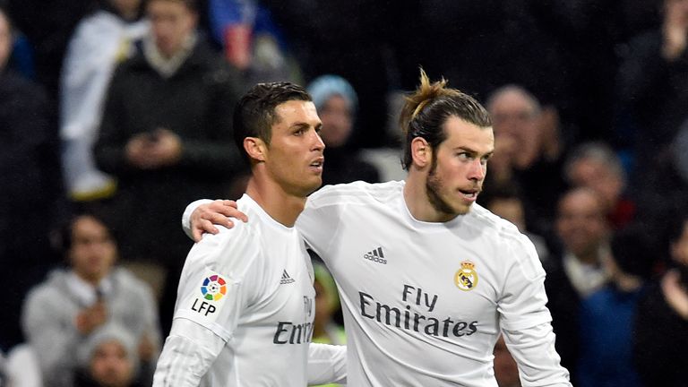 Real Madrid's Welsh forward Gareth Bale (R) celebrates a goal with Real Madrid's Portuguese forward Cristiano Ronaldo