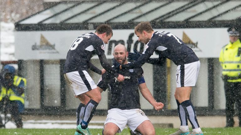 Gary Harkins (middle) celebrates after scoring to give Dundee a 2-0 lead over Partick Thistle