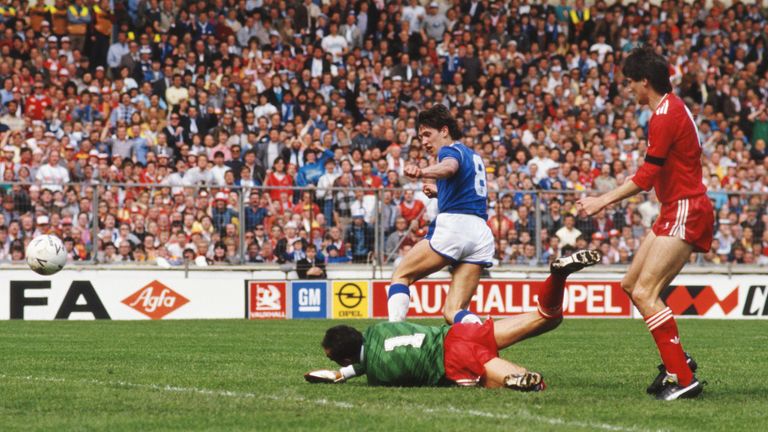 Everton striker Gary Lineker opens the scoring past Liverpool's Bruce Grobbelaar as Alan Hansen looks on, during the 1986 FA Cup Final on May 10th, 1986