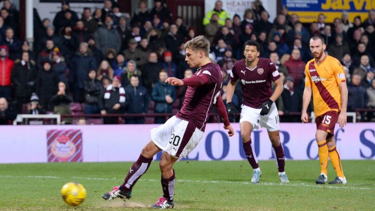 Hearts' Gavin Reilly fires the ball home from the penalty spot to score his side's third goal