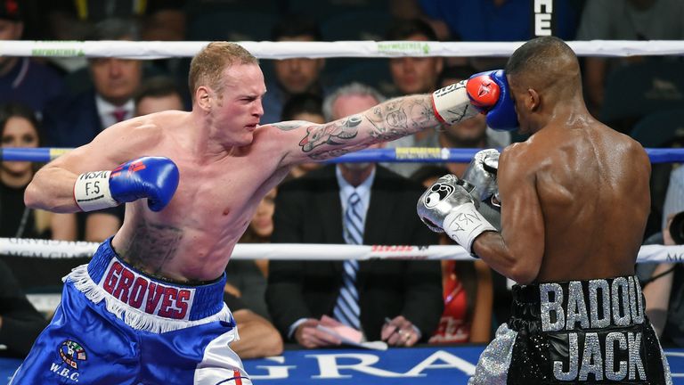 George Groves (L) hits Badou Jack in the second round of their WBC super middleweight title fight at MGM Grand Garden Arena 