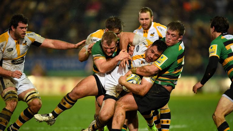  Wasps flanker George Smith is tackled by Mikey Haywood of  and Alex Waller of Northampton