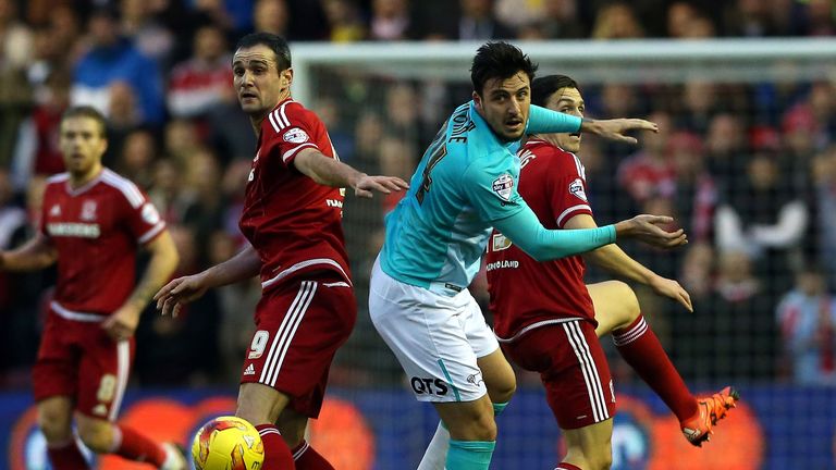 Kike (left) and Stewart Downing of Middlesbrough challenge Derby's George Thorne 