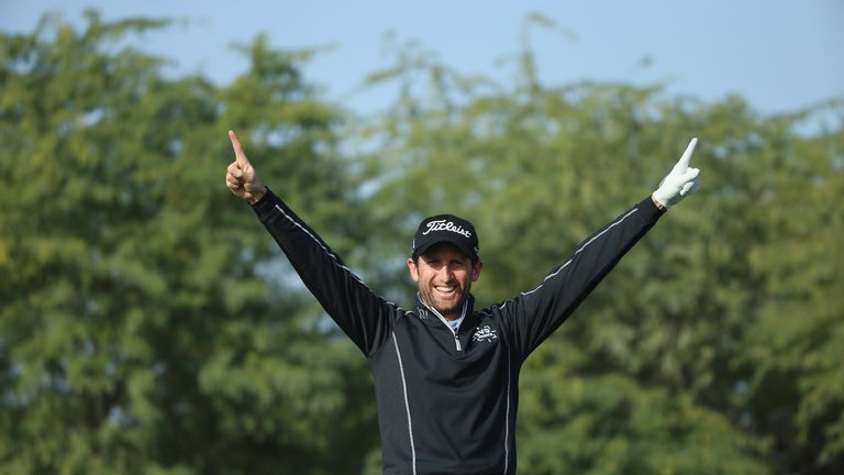 DOHA, QATAR - JANUARY 28:  Gregory Bourdy of France celebrates after making a hole-in-one on the eighth hole during the second round of the Commercial Bank
