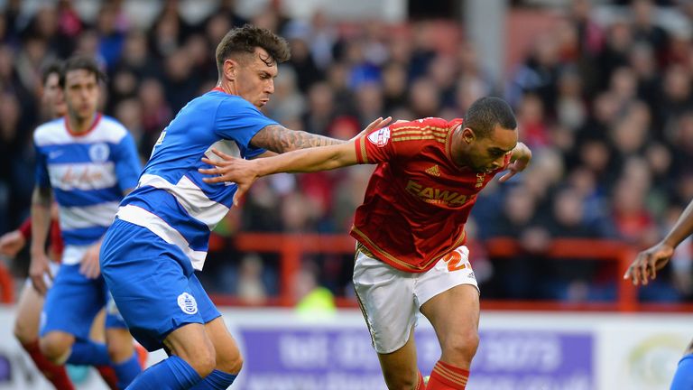 NOTTINGHAM, ENGLAND - JANUARY 09:  Dexter Blackstock of Nottingham Forest is tackled by Grant Hall of Queens Park Rangers during The Emirates FA Cup Third 