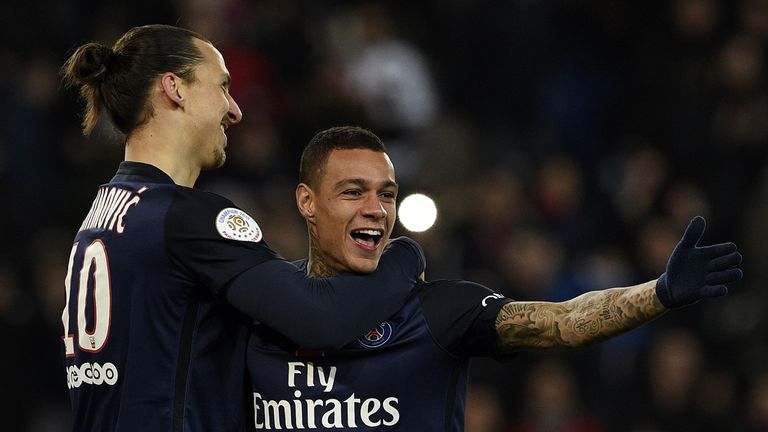 Gregory Van der Wiel (right) celebrates his goal for PSG with fellow scorer Zlatan Ibrahimovic (left)