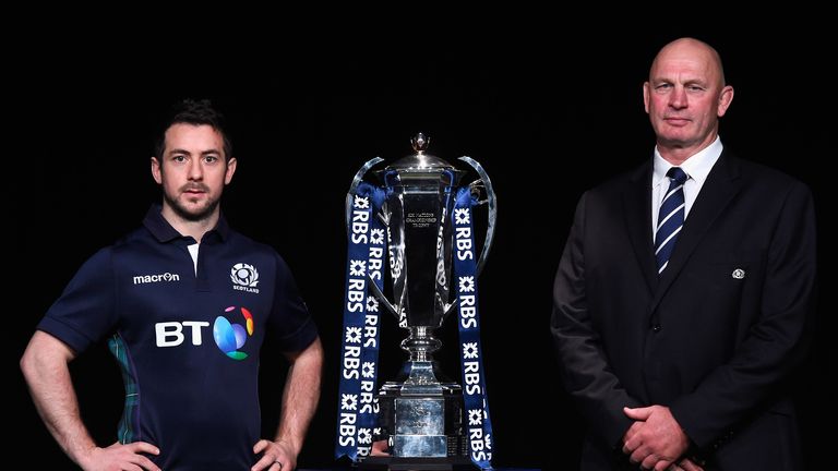 LONDON, ENGLAND - JANUARY 27:  Greig Laidlaw, captain of Scotland and head coach Vern Cotter pose with the trophy during the RBS Six Nations launch at The 