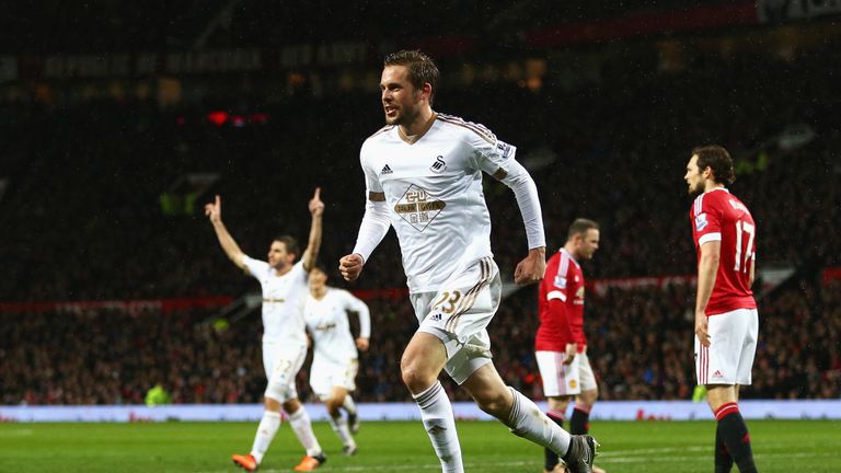 Gylfi Sigurdsson of Swansea City celebrates scoring his team's first goal during the Barclays Premier League match against Manchester United to make it 1-1