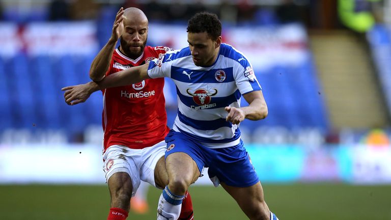 Hal Robson-Kanu of Reading holds off the challenge of Paul Downing of Walsall during The Emirates FA Cup Fourth Round match