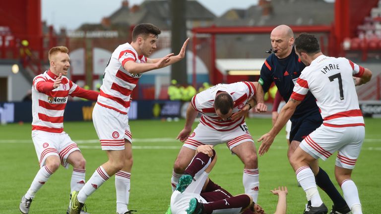 Hamilton players Darian MacKinnon (centre) and Dougie Imrie reacted angrily to Igor Rossi's challenge