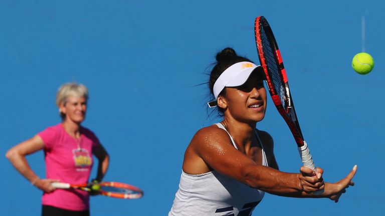 Heather Watson volleys in front of Judy Murray during a practice session ahead of the Australian Open 