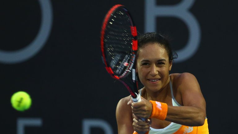 Heather Watson of Great Britain plays a backhand in the women's single's match against Teliana Pereira of Brazil 