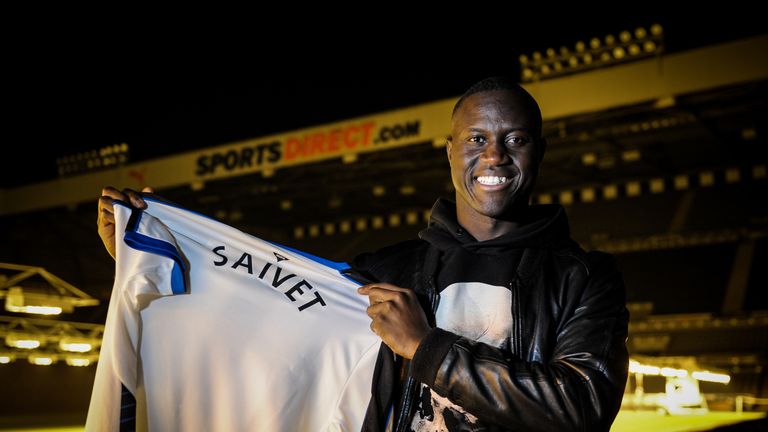 Newcastle United's January signing Henri Saivet poses for photographs pitch side at St James' Park holding a football shirt